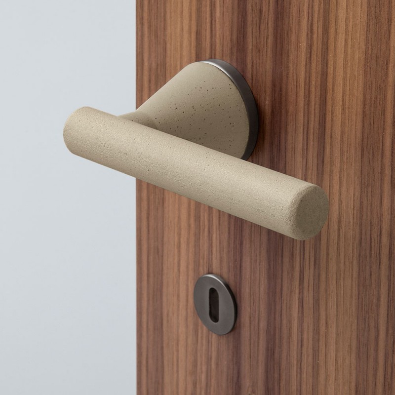 Juno Minimalist Cement Door Handle Sand Color on Rosette by Designer Alessandro Dubini for Mandelli